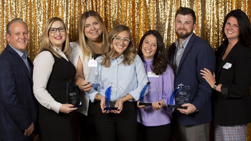 image of Mintz and Hoke employees holding PRSA awards